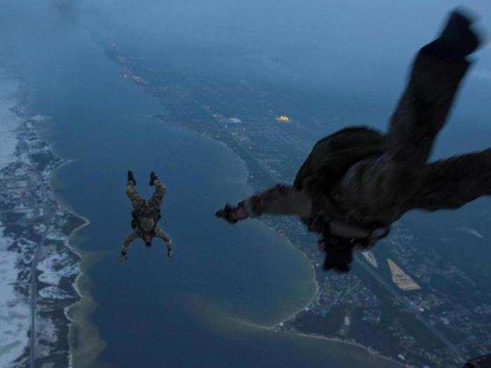 Instructors assigned to the 1st Special Operations Support Squadron, Operational Support Joint Office, jump from a 15th Special Operations Squadron MC-130H Combat Talon II above northwest Florida on June 28.