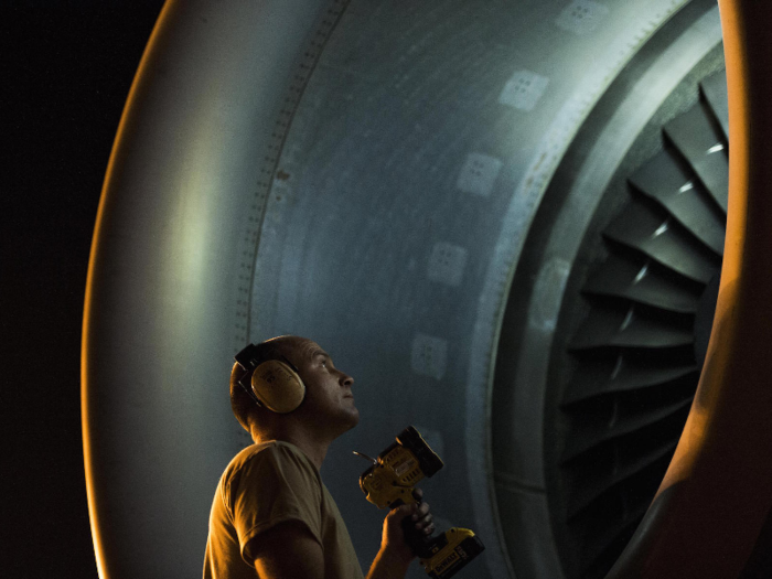 Tech. Sgt. Jonathan Carr, a crew chief with the 62nd Aircraft Maintenance Squadron at Joint Base Lewis-McChord in Washington state, checks the engine of a C-17 Globemaster III during Exercise Mobility Guardian at the base on August 6.