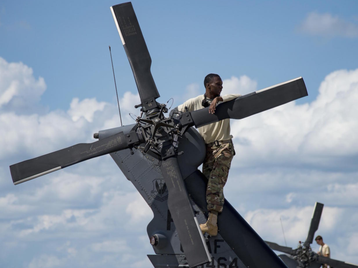 Airmen from the 41st Helicopter Maintenance Unit perform post-flight maintenance on an HH-60G Pave Hawk helicopter at Moody Air Force Base, Georgia on September 3.