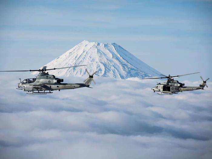 Marines working with III MEF Marines fly the AH-1Z Viper and UH-1Y Venom past Mount Fuji in Japan on March 22.