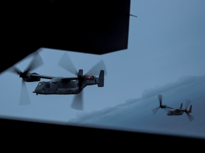 MV-22B Ospreys with Marine Medium Tiltrotor Squadron 162, 26th Marine Expeditionary Unit, transports Marines to land from the amphibious assault ship USS Iwo Jima during an exercise in the Atlantic Ocean on December 7.