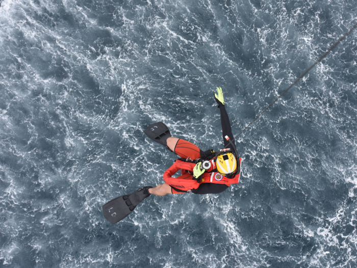 Petty Officer 2nd Class Lyman Dickinson, an aviation survival technician at Coast Guard Sector San Diego, is lowered into the water from an MH-60 Jayhawk helicopter during a joint search-and-rescue exercise with the Mexican navy off the coast of Ensenada, Mexico on June 7.