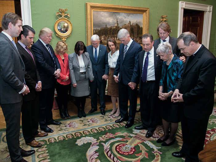 January 31, 2017: Trump joins Judge Neil Gorsuch, his wife Louise, and other in prayer in the Green Room of the White House, following Trump