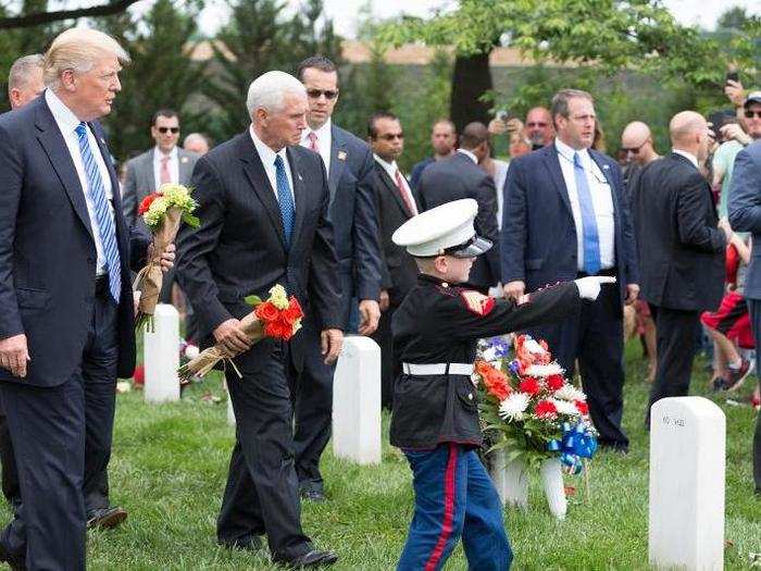 May 29, 2017: Trump and Pence are guided by six-year-old Christian Jacobs, son of fallen US Marine Sgt. Christopher Jacobs, to his father