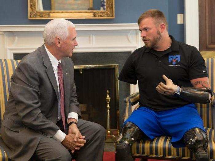 July 10, 2017: Pence speaks with retired US Army Staff Sgt. Travis Mills of the 82nd Airborne Division.