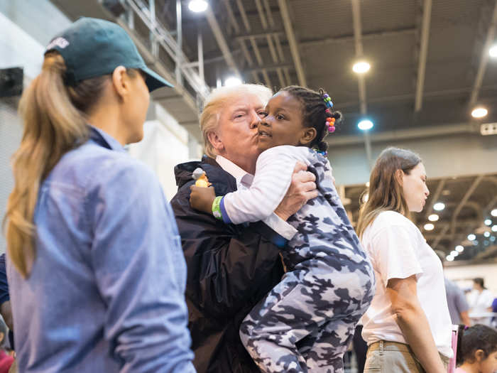 September 2, 2017: Trump, while visiting the NRG Stadium in Houston, Texas, kisses a young evacuee displaced by Hurricane Harvey.