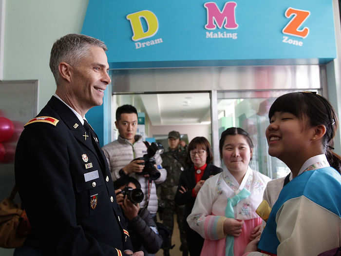 In Daeseong-dong, the only village where citizens can reside in the DMZ, soldiers regularly attend school graduations.