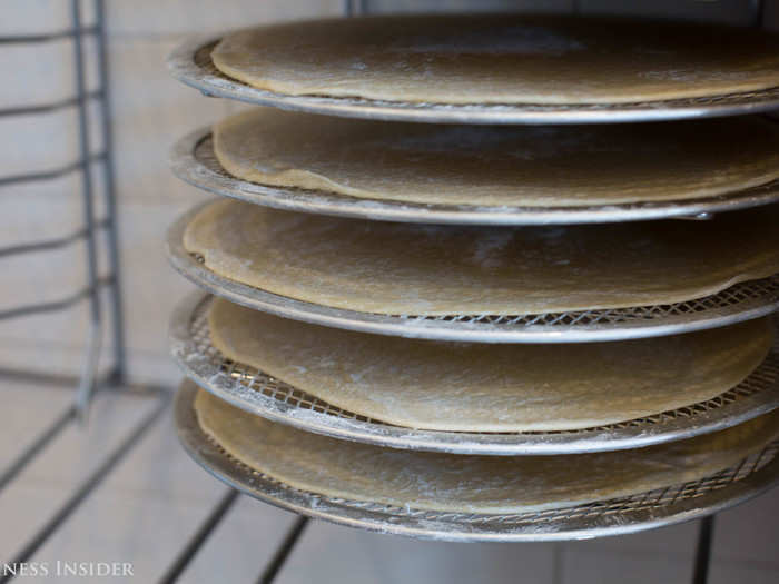 The dough, a proprietary recipe, gets pressed in a machine so it