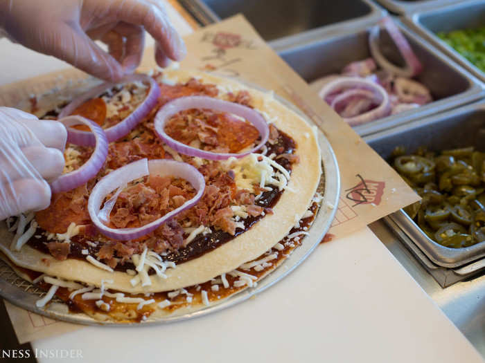 Customers with bigger appetites can order a "Mega" pizza, which stacks any two pizza crusts on top of each other. It costs $3 extra and is very Instagram-worthy.