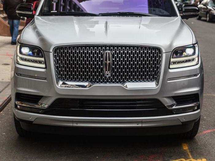 Of course the Navigator really announces itself with its bold grille and front fascia: the grillework itself replicates the shape of the famous Lincoln star badge — which, by the way, lights up.