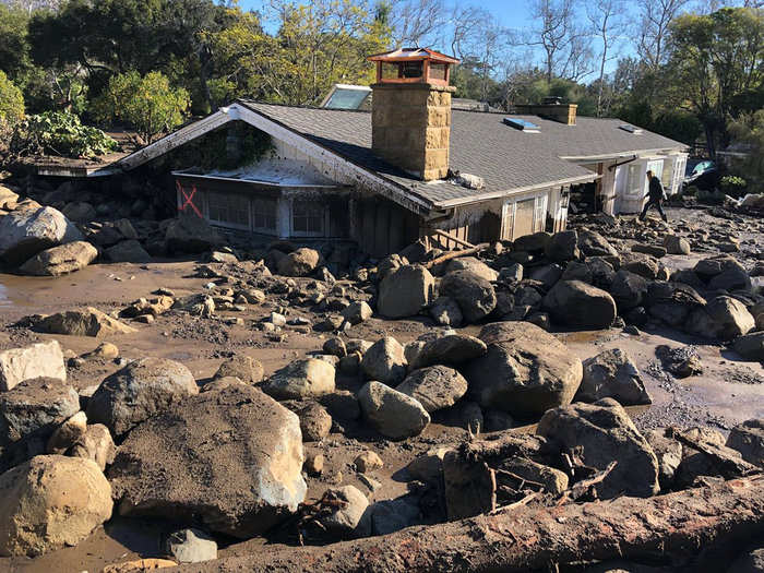 With little vegetation to stop the hills from collapsing, roughly 100 single-family homes were destroyed and 300 damaged.