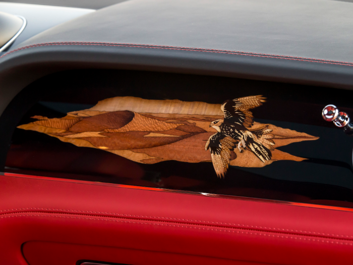 The custom hide-trimmed cabin of the car is finished with this 430-piece desert scene, assembled over the course of nine days.