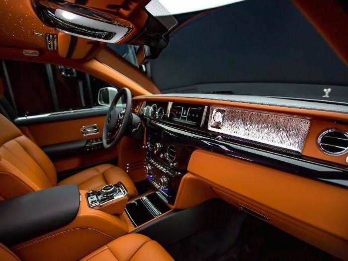 Uninterrupted glass runs along the dashboard of this Rolls Royce, allowing patrons to commission and curate unique pieces to display their personal tastes!