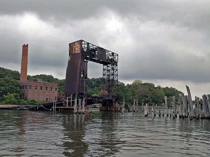 Pulling up to the island, we navigated around rotten dock supports. The ferry dock and its rusted derrick looked ready to collapse at any moment.