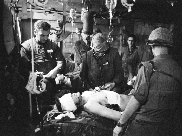 Makeshift medical facilities at the base were mostly underground. Despite this, doctors and medics had to work around the clock wearing helmets and flak jackets, as seen here.