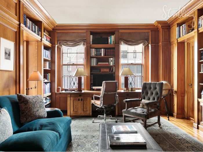 The wood-paneled library is sure to be a favorite of any book lovers.