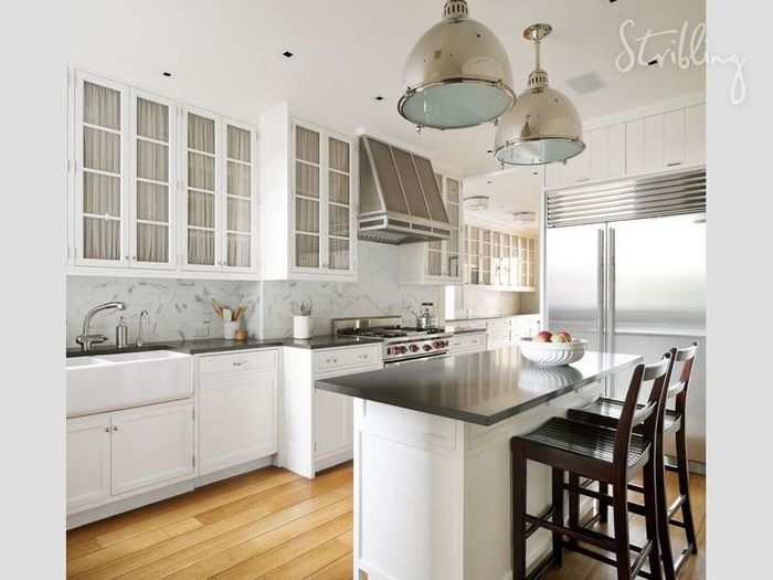 The kitchen appears to have an industrial stove and a breakfast bar for you to enjoy your coffee.