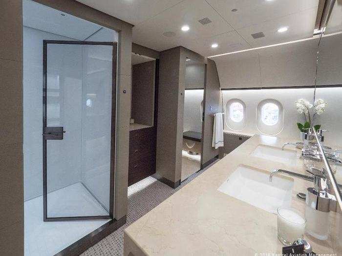 ... A master bath with double-size shower and heated marble floors.