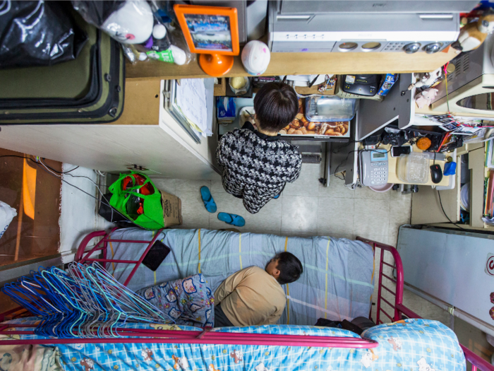 But families also find their way to these micro-apartments. In a 60-square-foot apartment in Hong Kong, a mother spends $487 a month to house herself and her son. Families who are less fortunate must split up due to lack of space.