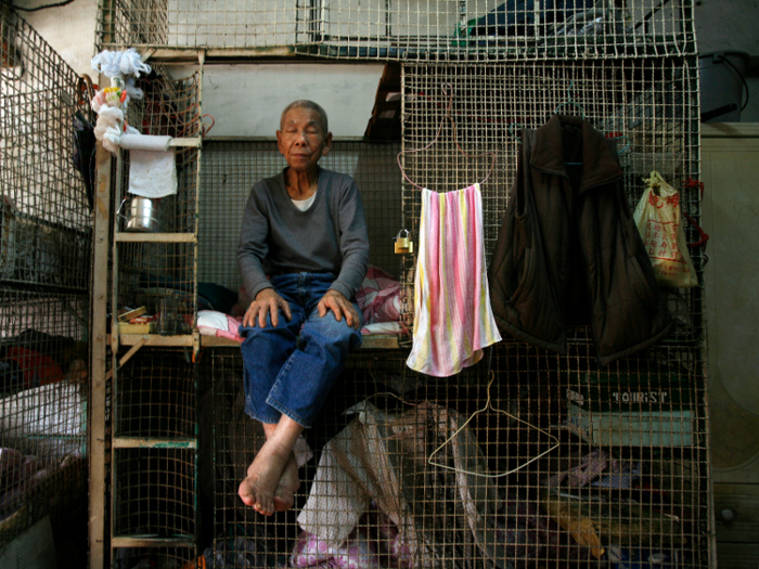 But not even coffin homes are the worst of it. Some residents, predominantly elderly men, stay in public housing that swap bunk beds for stackable cages. Typically, up to 12 men live in one room.