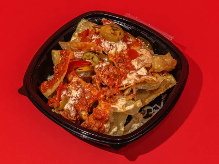 Lo and behold, here they are. Fried squares of lasagna pasta sheets, slathered in a ragu, smothered in mozzarella and parmesan, dotted with cherry peppers, and drizzled with Alfredo sauce.