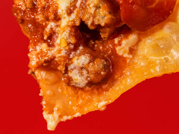 The ragu — with sausage, chicken, and beef — is a tiny bit sweet, but not to the point of concern. The cherry peppers are the Italian twist to nachos