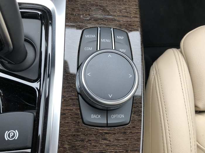 The iDrive infotainment system is controlled with this puck-dial and button interface.