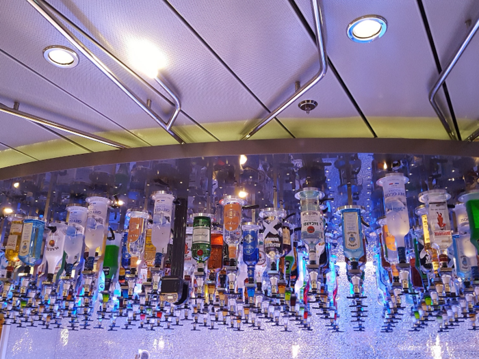 Spirits of all kinds — gin, whiskey, vodka, rum, you name it — are suspended from the ceiling. There are 153 bottles of liquor for the bar. Their position is input into the computer system so the robotic arms know which drink to get.