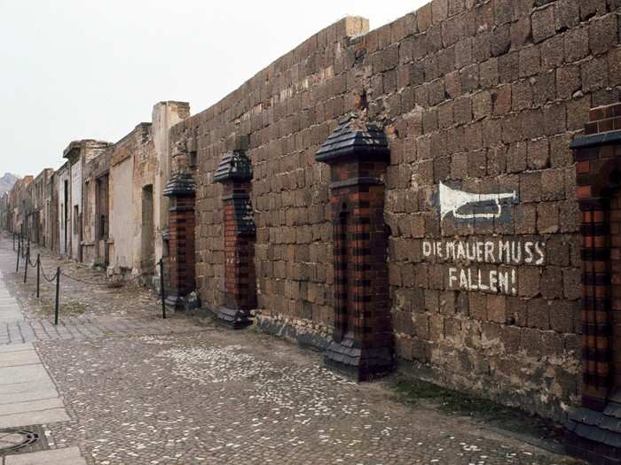 While the wall dividing East and West Berlin was only 27 miles long, an additional 100 miles of wall encircled West Berlin, which was totally surrounded by East Germany. Here, the wall can be seen along Bernauer Strasse in 1973.