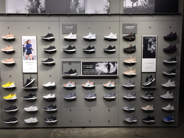 The Adidas store had a more subtle and effective strategy for showing off its products, often placing shoes against walls with muted colors and using small, rectangular posters to separate the shoes into smaller groups that were easy to visually process.