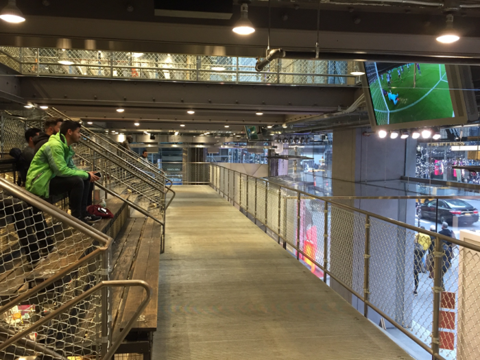 Between the first and second floors, there were two sets of bleachers where people could watch sports while their friends, family members, and significant others shopped.