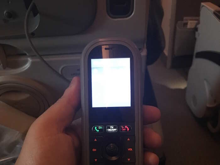 The system can be controlled either by using the seatback touchscreen or this remote control.