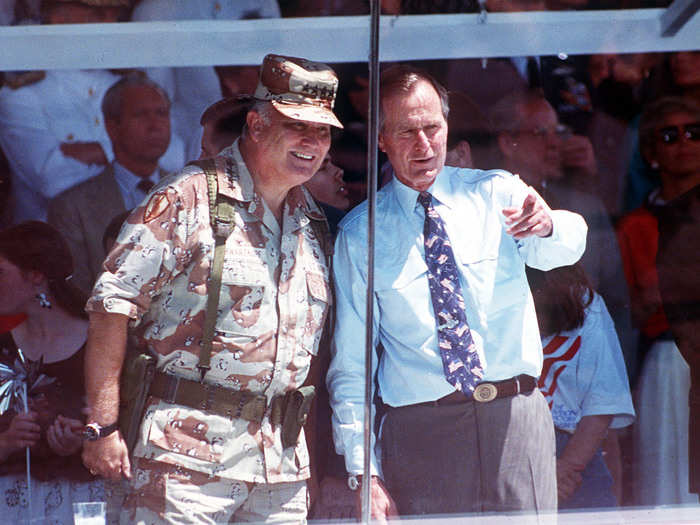 He later joined in President Bush in the viewing stand.