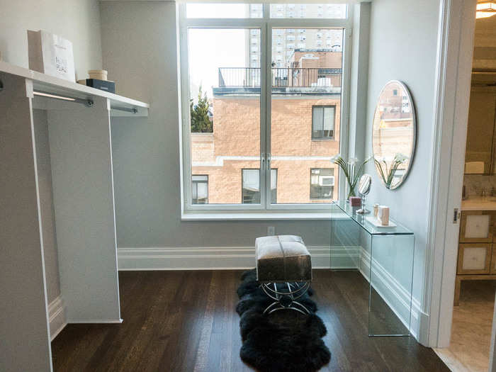 There are his-and-hers walk-in closets. This one, attached to the bathroom, has enough space for a vanity or makeup table.