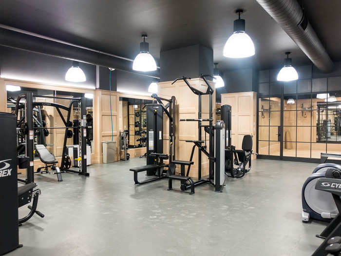 The gym features a yoga room, boxing gym, and various machines. A custom walnut free-weight collection has been ordered from Europe. "They definitely cost more than my parents