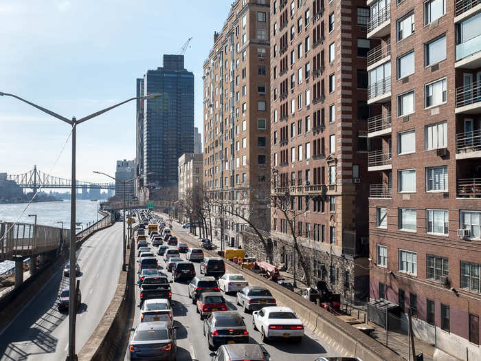 The walk sits above the FDR Drive parkway. According to Baquero, the East River used to extend up to the buildings on the right, many of which had marinas and yacht landings for the residents.