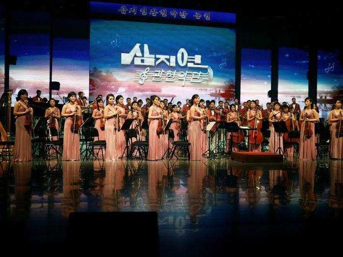 The orchestra ended its performance with a theme that reflected the country
