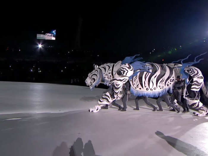 The show opened with a large white tiger being followed by a group of children out of cave.