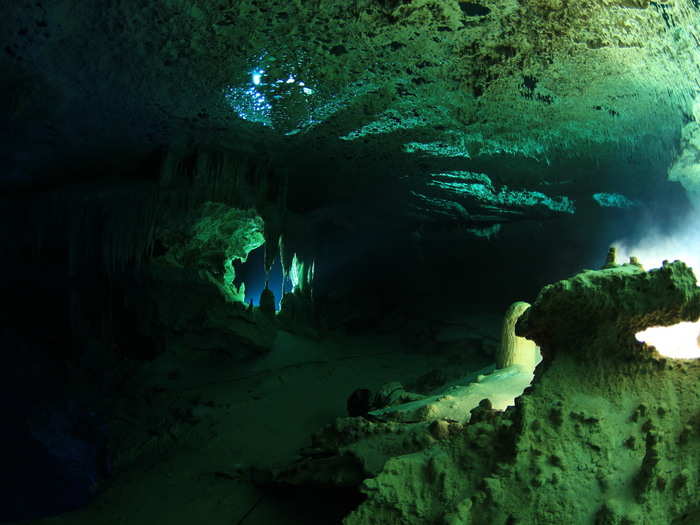 Bringing an intact skeleton up through pitch-black passages like these requires careful teamwork, top-notch equipment, and coordination.