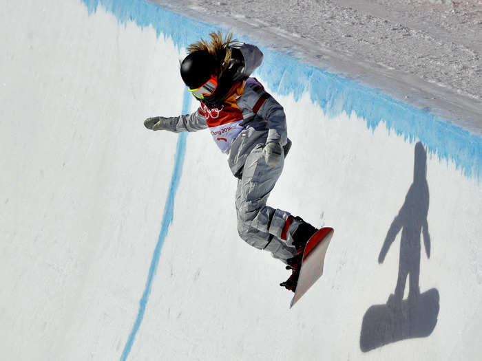 The silhouette on the wall looks almost child-like, fitting for a competitor who dedicated herself to the sport at a young age.