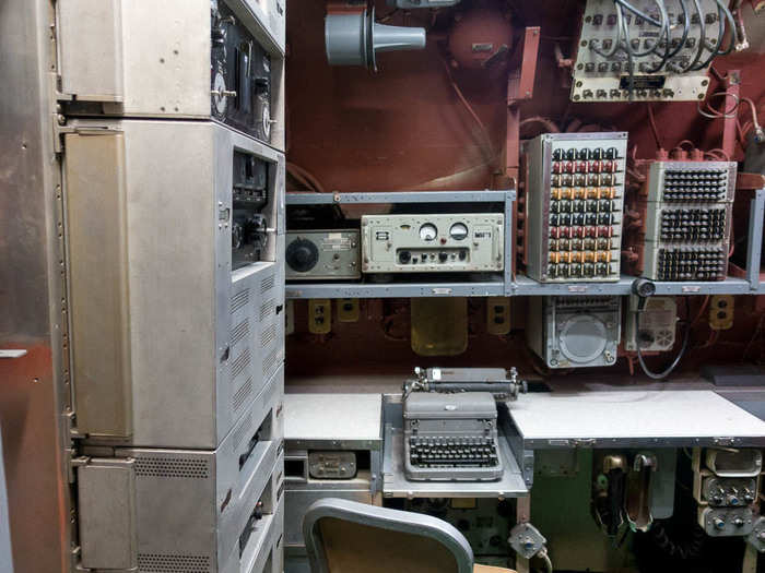 This is the radio room. The Growler could send messages at periscope depth, but usually it only received them. During the 1962 Cuban Missile Crisis, the Growler was on alert, ready to fire its nuclear missiles, and could only receive messages. If a false message was sent to the sub, they