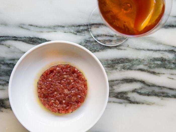 "A simple red disc on a white plate, Flora Bar