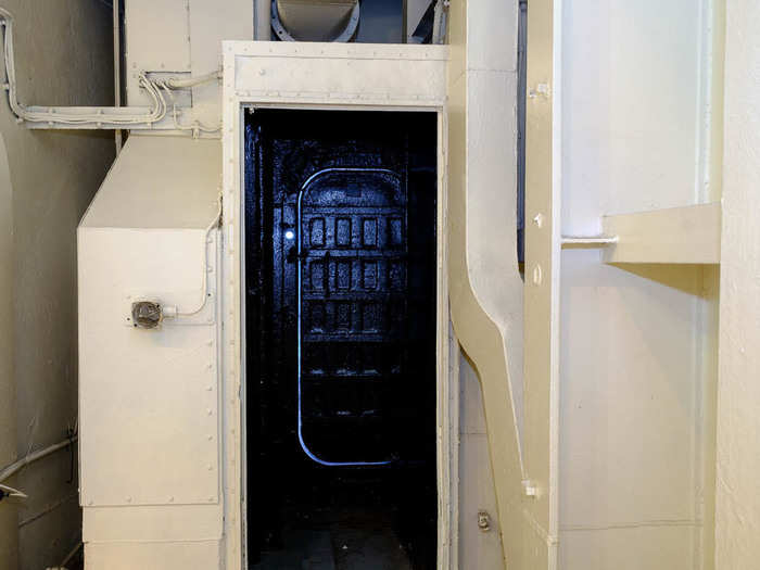 During wartime, the ship operated under "blackout" conditions at night. The crew would block all openings so no light leaked out. They used these "light locks" to move in and out of the ship. The door was covered with heavy black cloth.