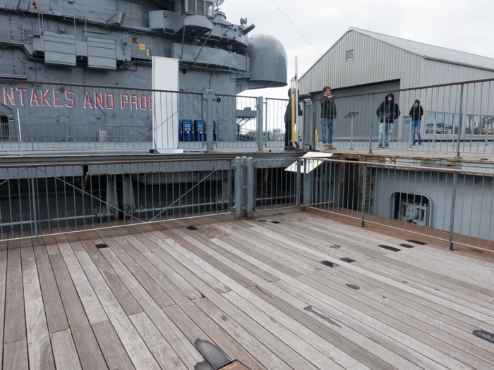 Crewmen used this massive portside elevator to bring planes from the hangar to the flight deck. Notice the wood flooring, which the entire flight deck was once made of.  During their downtime, rewmen often used the elevator for sporting events.