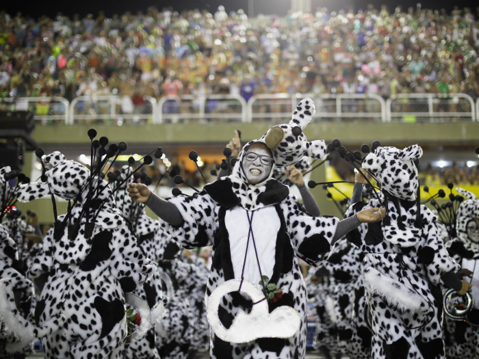 Orchestras and bands play samba music while their schools are making their way down the aisle.