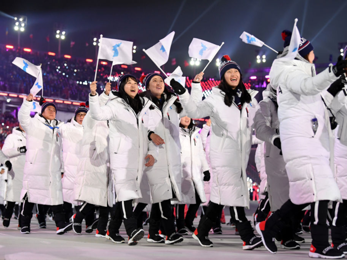 North and South Koreans marched under a single unification flag.