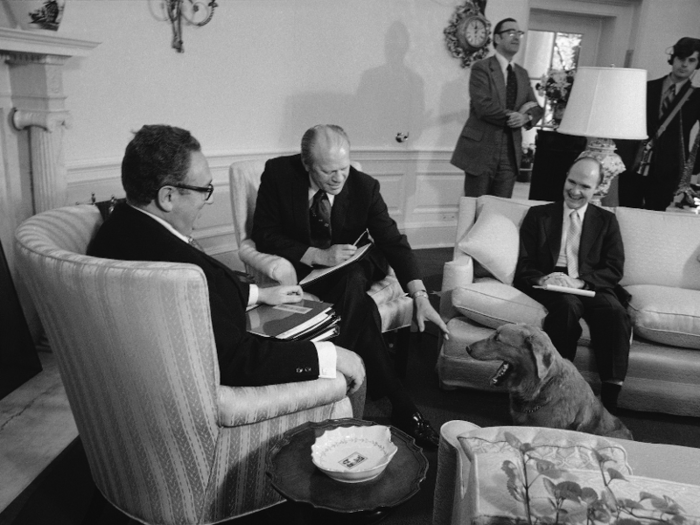 For Gerald Ford, a gold and blue floral rug and pumpkin-colored drapes were the order of the day. Ford also introduced Queen Anne armchairs and striped sofas to the Oval Office, kept the Wilson desk, and banished the sconces.