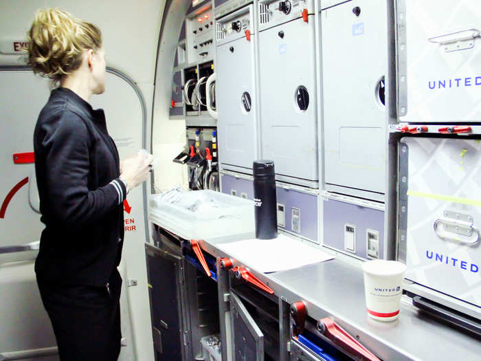 While Bingochea performs his checks, his back-galley partner, Kristine, who is working the FA02 position, checks the galley to make sure food, drinks, and other items are on board and stowed properly.