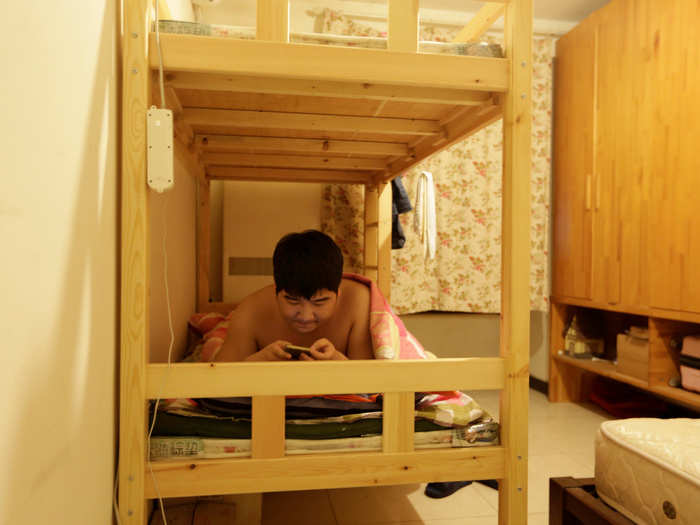 Tech workers often share cramped living spaces, like this one at N-Wei Technology Company Limited in Beijing. Larger firms often rent apartments as dual-use offices and employee dormitories.