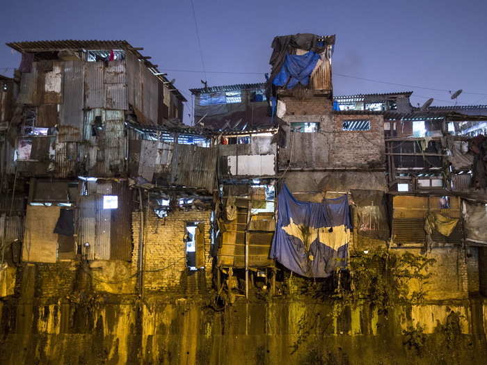 The high cost of living pushed many Mumbai residents into slums like Dharavi, where people pack into haphazardly constructed shanties lacking sewage and running water.